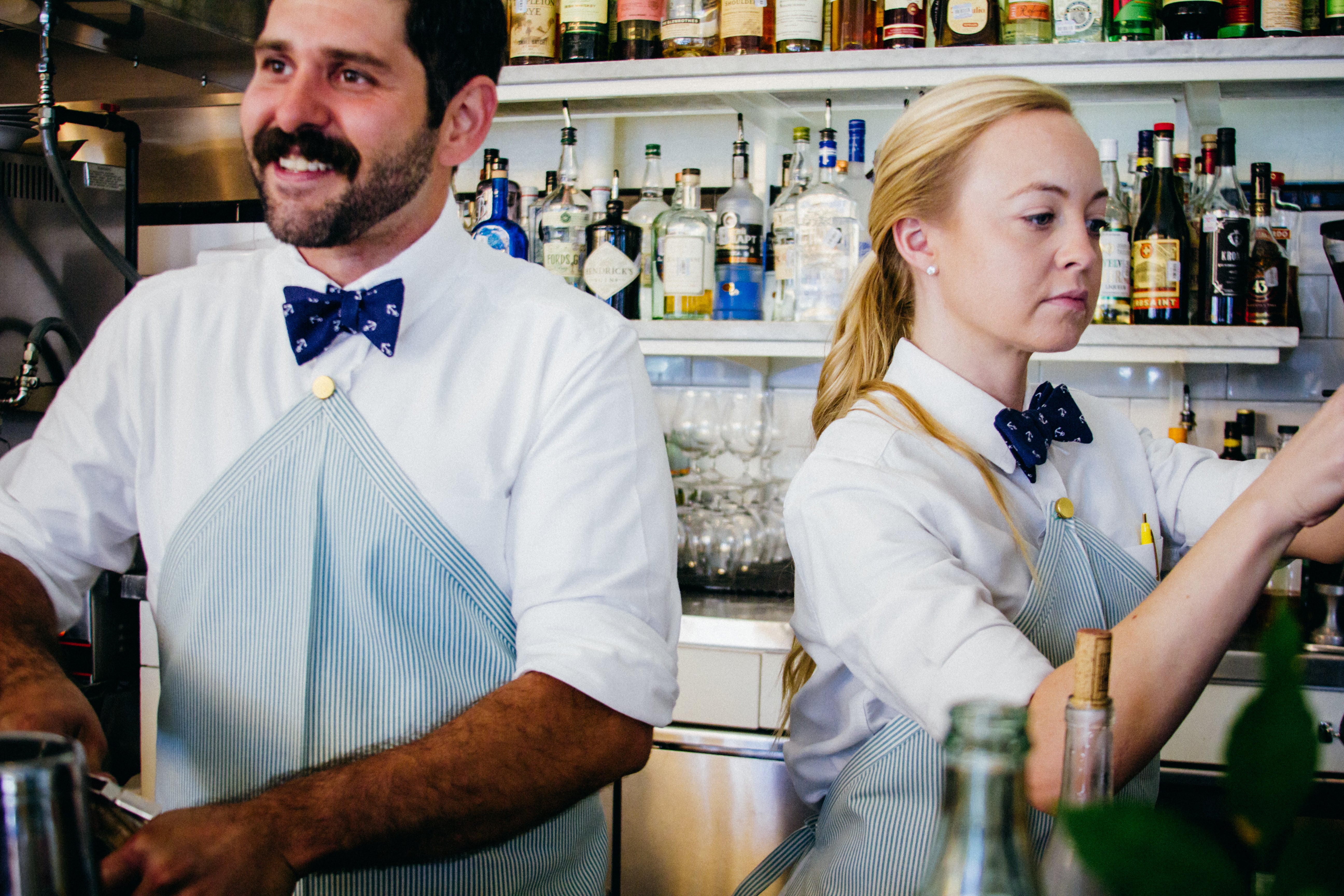 Apron uniforms made by Savilino at Clarks Oyster Bar