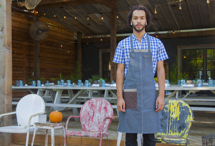 Savilino bib apron on a restaurant patio