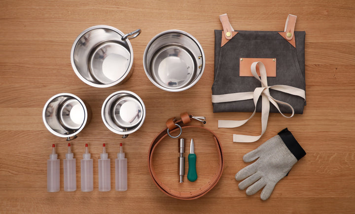 Components for full Oyster Apron Kit: belt, bain maries, squeeze bottles, knife, glove, shaker