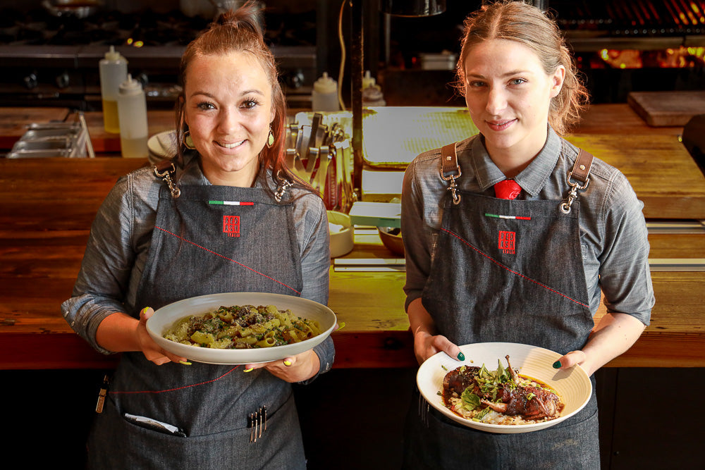 Women wearing custom Red Ash bib aprons made by Savilino