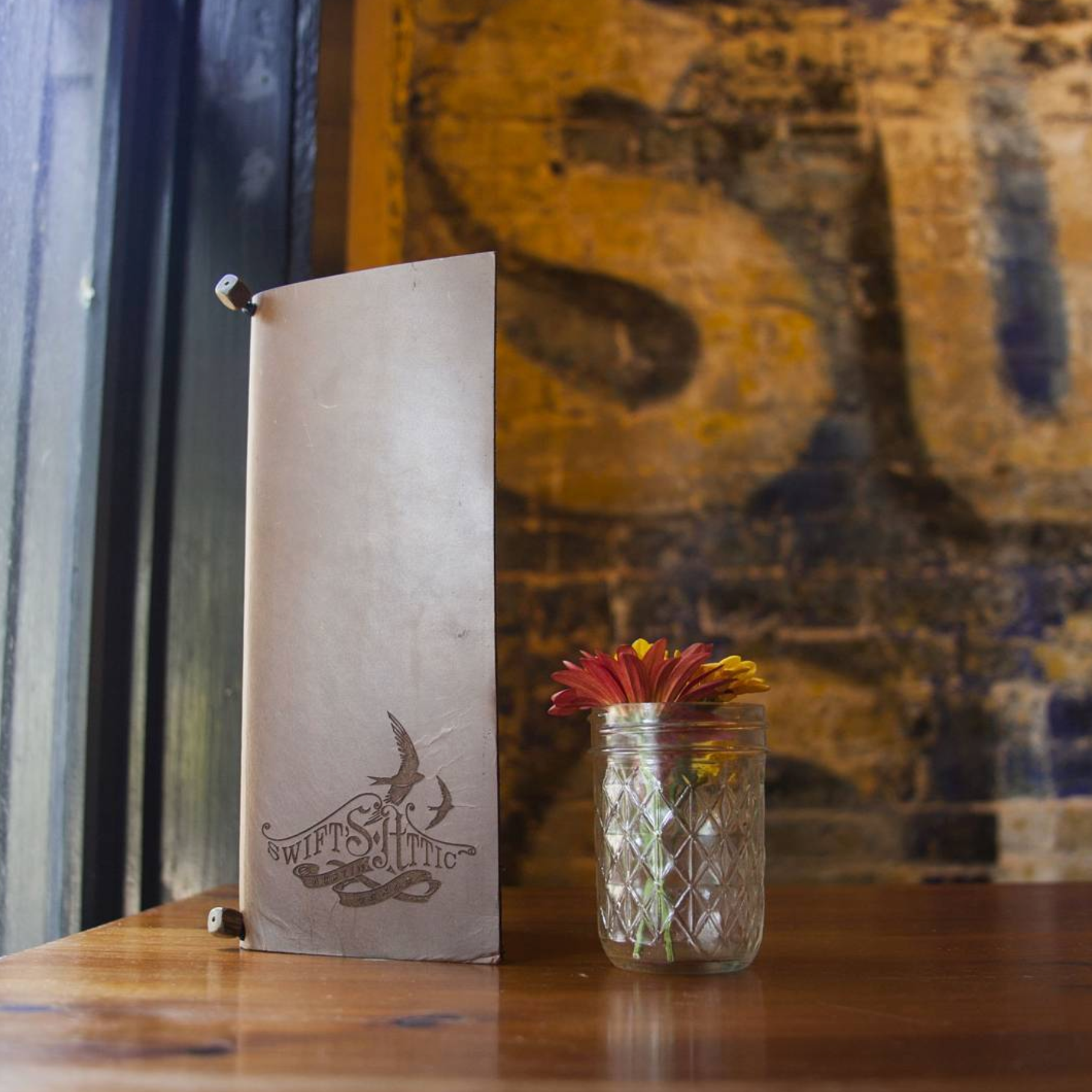 Savilino tall custom leather menu in a bar setting