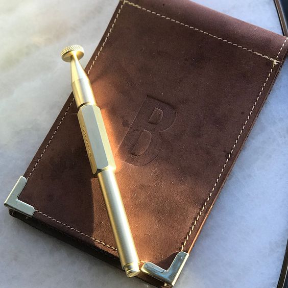 Custom Savilino check presenter with metal corners