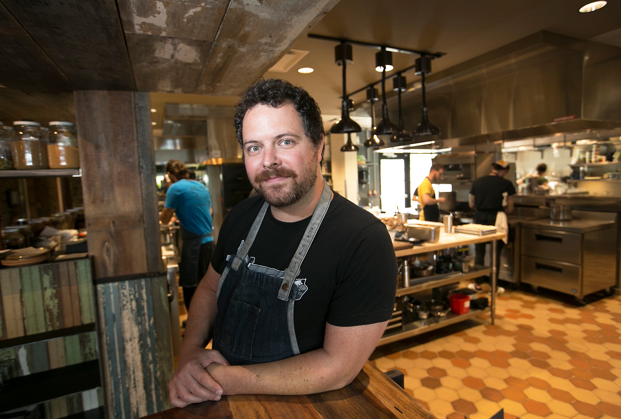 Savilino bib apron worn in a restaurant kitchen